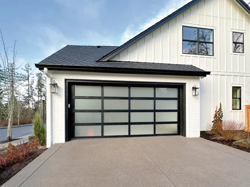 Modern black satin residential garage door with frosted glass panels, enhancing curb appeal and security for homes.