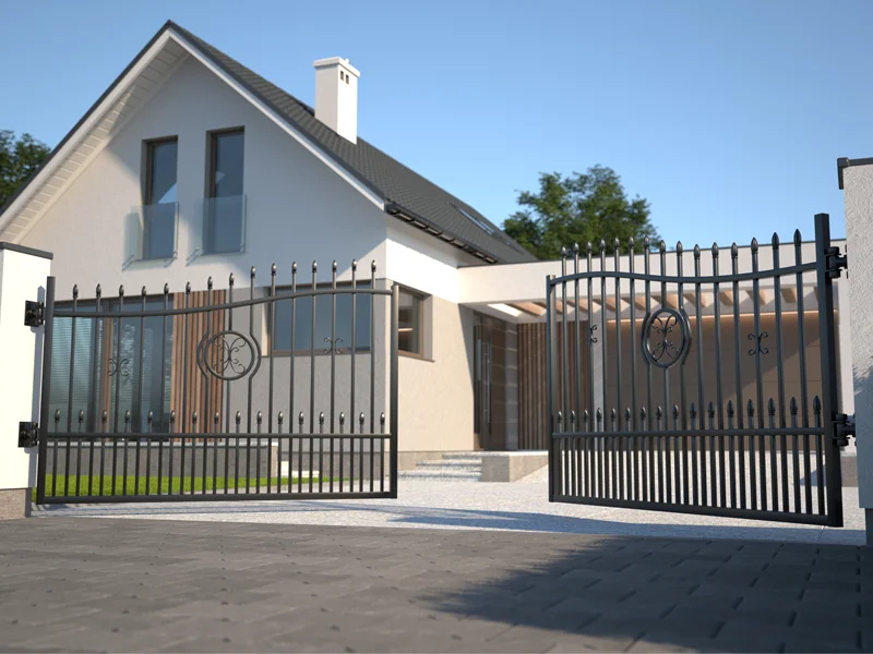 Modern residential gate with elegant design, open to reveal a stylish home entrance, showcasing secure and convenient access solutions from Overhead Door Company of The Desert™.