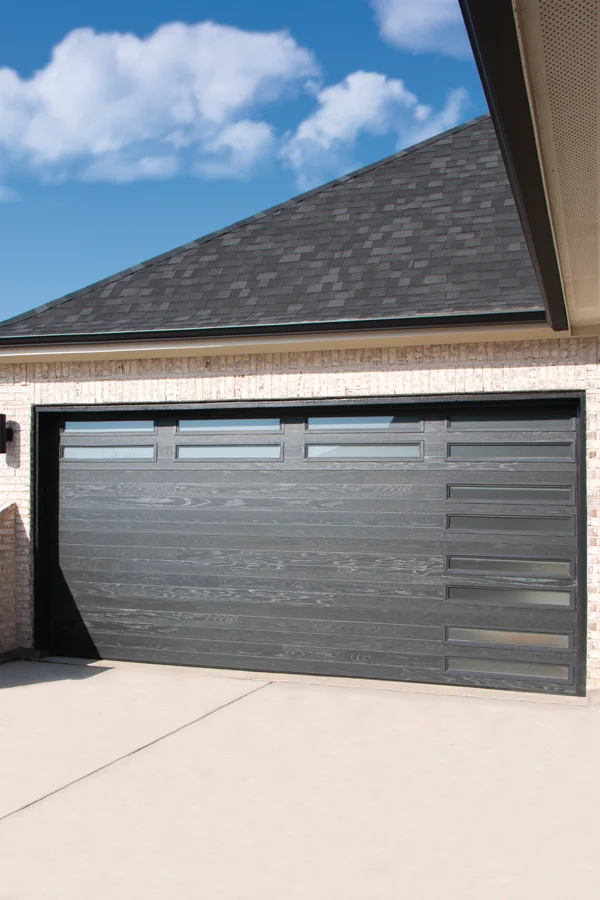 Stylish energy-efficient residential garage door with modern design and windows, enhancing curb appeal in Thousand Palms, CA.