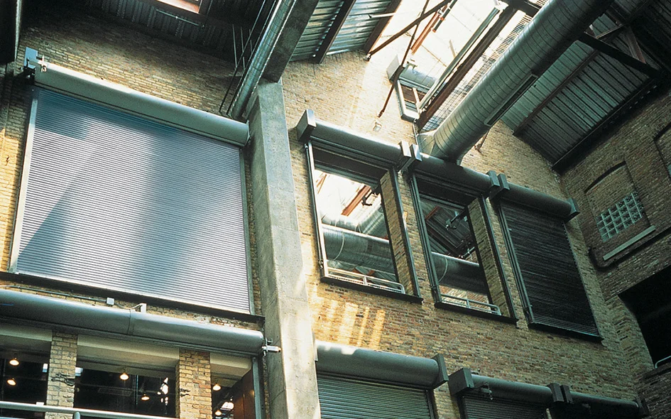Fire-rated rolling service doors in a commercial setting, showcasing the FireKing® Model 634, emphasizing safety and security features.
